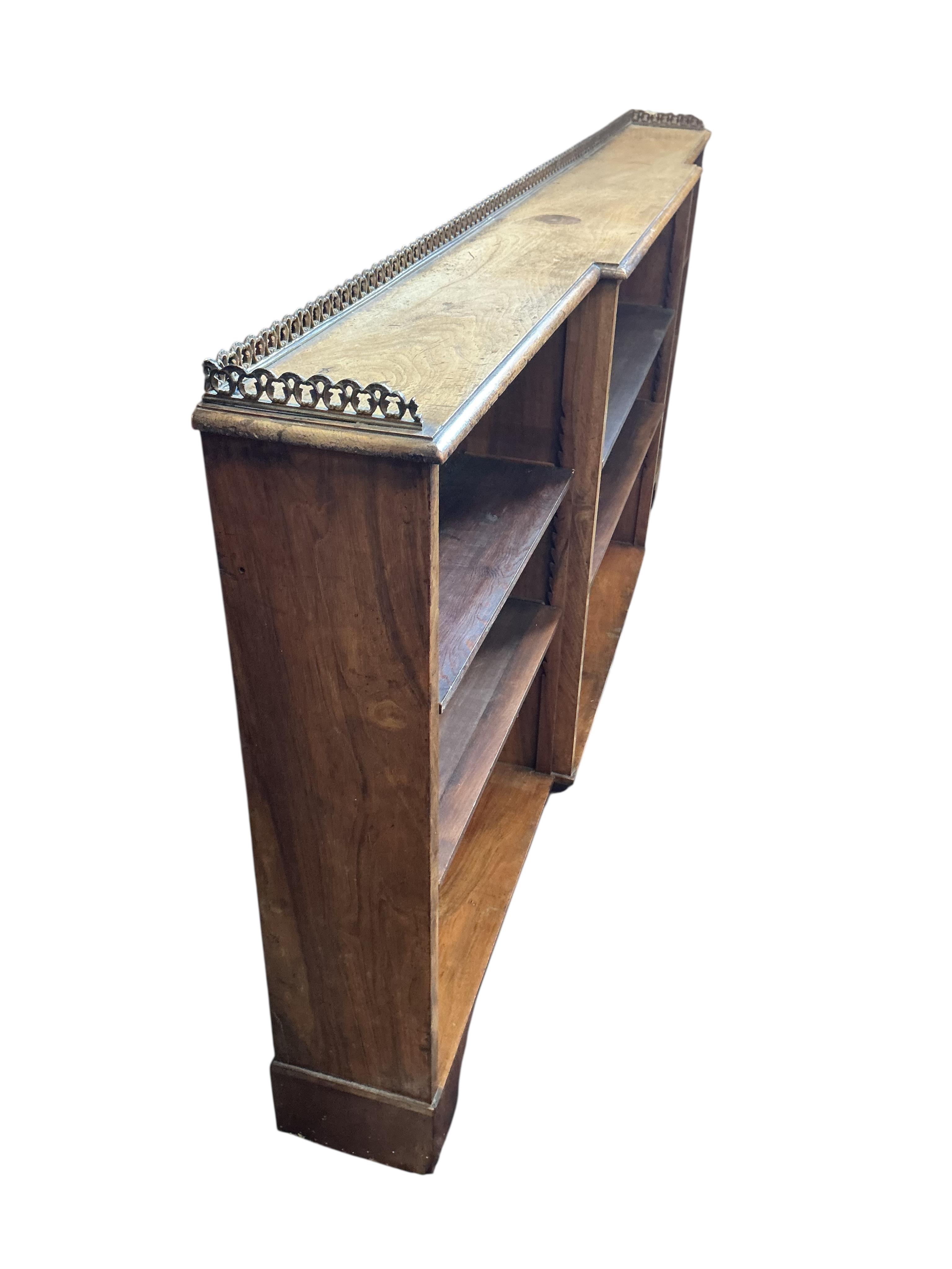 A Regency style faded rosewood dwarf breakfront open bookcase, width 166cm, depth 18cm, height 75cm